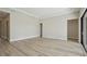 Open living space with wood flooring, recessed lighting, and access to backyard at 3448 Yellow Leaf Cir, Spring Hill, FL 34609