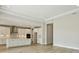 Open-concept living area with a view of the kitchen featuring modern appliances and stylish finishes at 3448 Yellow Leaf Cir, Spring Hill, FL 34609