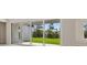 Bright room featuring sliding glass doors that open to a spacious backyard at 3448 Yellow Leaf Cir, Spring Hill, FL 34609