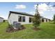 The rear of the property has an expansive backyard with mature landscaping at 3458 Yellow Leaf Cir, Spring Hill, FL 34609