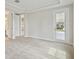 A bright bedroom with neutral carpet and a view to the exterior at 3458 Yellow Leaf Cir, Spring Hill, FL 34609