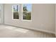 Bright bedroom with large windows offering natural light and neutral carpeting throughout at 3458 Yellow Leaf Cir, Spring Hill, FL 34609