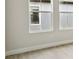 Bright bedroom with neutral walls and tile floors with natural light from the window at 3458 Yellow Leaf Cir, Spring Hill, FL 34609