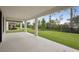 The home has a covered patio with views of the lush, fenced backyard at 3458 Yellow Leaf Cir, Spring Hill, FL 34609
