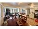 Open-concept living room with hardwood floors, and a view into the dining area and kitchen at 3542 Monticello St, New Port Richey, FL 34652
