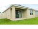 Covered back patio with a ceiling fan, offering a comfortable outdoor living space at 3762 Mossy Limb Ct, Palmetto, FL 34221