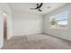 Light-filled bedroom with a large window, carpet and access to a bathroom with a shower at 3762 Mossy Limb Ct, Palmetto, FL 34221