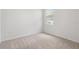 A secondary bedroom provides a blank canvas with a carpeted floor at 3762 Mossy Limb Ct, Palmetto, FL 34221