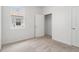 Bright bedroom features neutral carpet, a window with blinds, and a closet at 3762 Mossy Limb Ct, Palmetto, FL 34221