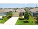 Inviting home with a manicured lawn, stone accents, and a two-car garage in a residential neighborhood at 3762 Mossy Limb Ct, Palmetto, FL 34221