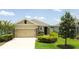 Charming single-story home featuring an attached two-car garage and well-maintained landscaping at 3762 Mossy Limb Ct, Palmetto, FL 34221