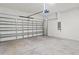 Clean garage with automatic door and sealed cement flooring at 3762 Mossy Limb Ct, Palmetto, FL 34221