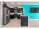 Modern kitchen with dark wood cabinets, granite countertops, and stainless steel appliances at 3762 Mossy Limb Ct, Palmetto, FL 34221