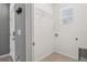 Bright laundry room with a tile floor, shelving, and washer/dryer hookups at 3762 Mossy Limb Ct, Palmetto, FL 34221