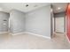 Open living space with tiled floors, neutral walls, and stylish modern lighting fixtures at 3762 Mossy Limb Ct, Palmetto, FL 34221