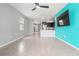 Spacious living room with tile flooring that leads into an open-concept kitchen and dining area at 3762 Mossy Limb Ct, Palmetto, FL 34221