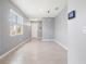Bright, empty living room featuring recessed lighting, neutral walls, and tiled floors at 3762 Mossy Limb Ct, Palmetto, FL 34221