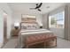 The main bedroom features a large window for natural light and neutral colors at 3762 Mossy Limb Ct, Palmetto, FL 34221