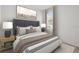 The main bedroom features a neutral palette and a large bed at 3762 Mossy Limb Ct, Palmetto, FL 34221