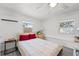 A quaint bedroom offers natural light and air conditioning for comfortable living at 4922 Bola St, New Port Richey, FL 34652