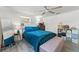 Charming bedroom with a black metal bed frame, stylish furnishings, and ample storage options at 4922 Bola St, New Port Richey, FL 34652