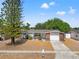 Charming single-story home boasts a well-maintained yard and inviting curb appeal at 4922 Bola St, New Port Richey, FL 34652