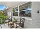 Covered front porch with outdoor seating and plants at 4922 Bola St, New Port Richey, FL 34652