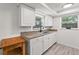 Kitchen sink and white cabinets provide storage and functionality at 4922 Bola St, New Port Richey, FL 34652