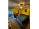 Cozy bedroom with carpet, ceiling fan, and access to ensuite bathroom at 5247 81St N St # 2, St Petersburg, FL 33709