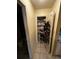 Hall closet provides storage for shoes and accessories at 5247 81St N St # 2, St Petersburg, FL 33709