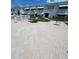 Well-maintained courtyard area with outdoor seating and lush landscaping near community pool at 5247 81St N St # 2, St Petersburg, FL 33709