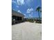 Well-maintained complex exterior with lush landscaping and ample parking at 5247 81St N St # 2, St Petersburg, FL 33709