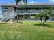 Well maintained two-story condo building with lush landscaping and light-colored exterior at 5247 81St N St # 2, St Petersburg, FL 33709