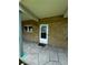 Charming front entrance with brick facade and covered porch at 5247 81St N St # 2, St Petersburg, FL 33709