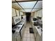 Cozy kitchen features white appliances and cabinetry with ample storage space at 5247 81St N St # 2, St Petersburg, FL 33709
