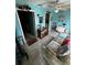 Bright living room with tile floors, ceiling fan, and comfortable seating area at 5247 81St N St # 2, St Petersburg, FL 33709
