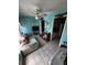 Comfortable living room featuring tile floors, ceiling fan, and access to kitchen and hallway at 5247 81St N St # 2, St Petersburg, FL 33709