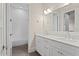 Well-lit bathroom featuring a double vanity with marble countertops and a subway tile lined shower with a tub at 534 Ladrone Ave, Tampa, FL 33606