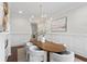 Bright dining room featuring a modern chandelier, seating for eight, and stylish decor throughout at 534 Ladrone Ave, Tampa, FL 33606