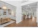 Hallway view shows the library, stairway to the second floor, and the living room with coffered ceilings at 534 Ladrone Ave, Tampa, FL 33606