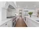 Contemporary kitchen with professional-grade appliances, marble countertops, and custom cabinetry at 534 Ladrone Ave, Tampa, FL 33606