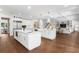 Bright, open kitchen featuring double islands, hardwood floors, and seamless flow into the living area at 534 Ladrone Ave, Tampa, FL 33606