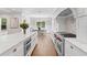 Beautiful gourmet kitchen featuring marble countertops and stainless steel appliances, including double ovens at 534 Ladrone Ave, Tampa, FL 33606
