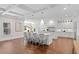 Gourmet kitchen with white cabinets, an expansive island with seating, and pendant lighting at 534 Ladrone Ave, Tampa, FL 33606