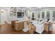 Spacious living room with hardwood floors, a built-in media center, and large windows overlooking the property at 534 Ladrone Ave, Tampa, FL 33606