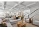 Open concept living room flows into kitchen with coffered ceilings and hardwood floors at 534 Ladrone Ave, Tampa, FL 33606