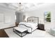 Elegant main bedroom with coffered ceilings, large windows, and modern decor at 534 Ladrone Ave, Tampa, FL 33606