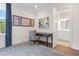 Inviting office area with a desk, decorative art, and a view into the bathroom at 534 Ladrone Ave, Tampa, FL 33606