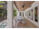 This screened patio offers comfortable seating and a beautiful view of the outdoor pool and surrounding landscape at 534 Ladrone Ave, Tampa, FL 33606