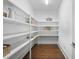 Walk-in pantry with ample shelving for optimal kitchen storage and organization at 534 Ladrone Ave, Tampa, FL 33606